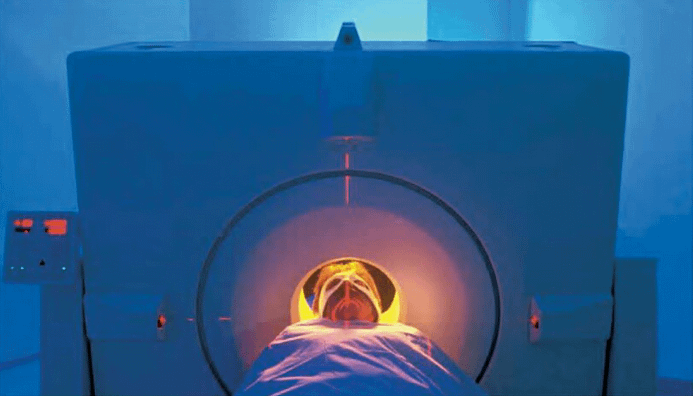 A patient receives a PET scan to pinpoint regions of the brain that are most active.